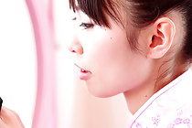 Minami H strips pink cheogsam at her dressing table