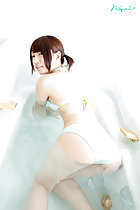 On all fours in bath looking over her shoulder ass raised out of water