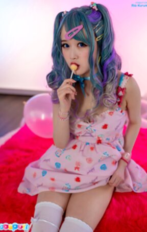 Ria Kurumi sucks lollipop and strips bra and panties showing shaved pussy