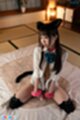 On her knees wearing shirt knee high stockings
