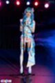 Standing at microphone