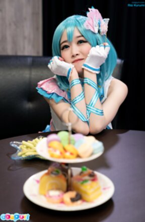 Ria Kurumi sitting at dinner table giving handjob