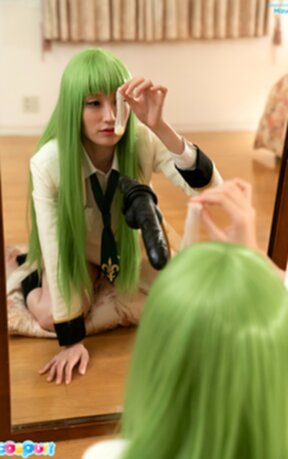 Mizuki on all fours in front of mirror sucking black dildo