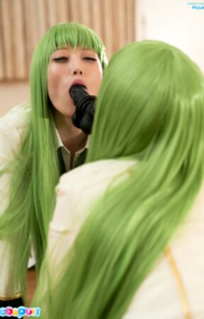 Mizuki on all fours in front of mirror sucking black dildo