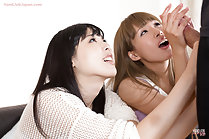 Girls stroking hard cock together