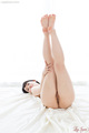 Legs raised to bare feet exposing labia.jpg