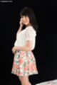 Looking back wearing floral pattern skirt