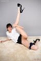 Lying on her side leg raised shaved pussy panties down high heels