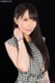 Long hair falling over her shoulders wearing wristwatch