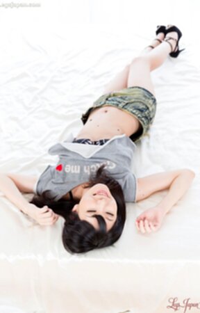 Tojo Aki in denim skirt lowers panties and shows her shaved pussy