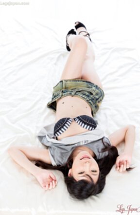 Tojo Aki in denim skirt lowers panties and shows her shaved pussy