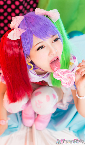Shaved Atomi Shuri on her knees sucking lollipop and cock