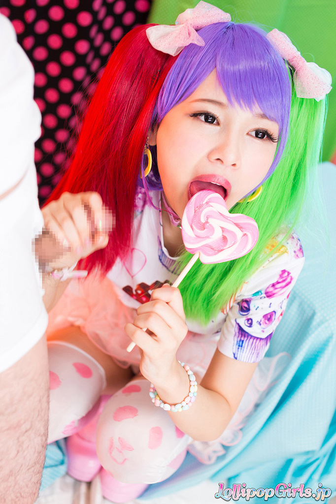 Licking lollipop giving handjob