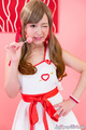 Sakura miyuki holding lollipop hand on hip