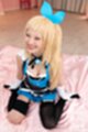 On her knees smiling broadly