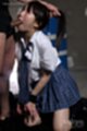 On her knees in uniform sucking cock looking up wrists tied