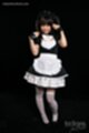 Hands raised hair in pigtails wearing uniform