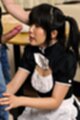 Kneeling in uniform hair in pigtails looking at hard cock