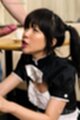 On her knees looking up wearing maid uniform